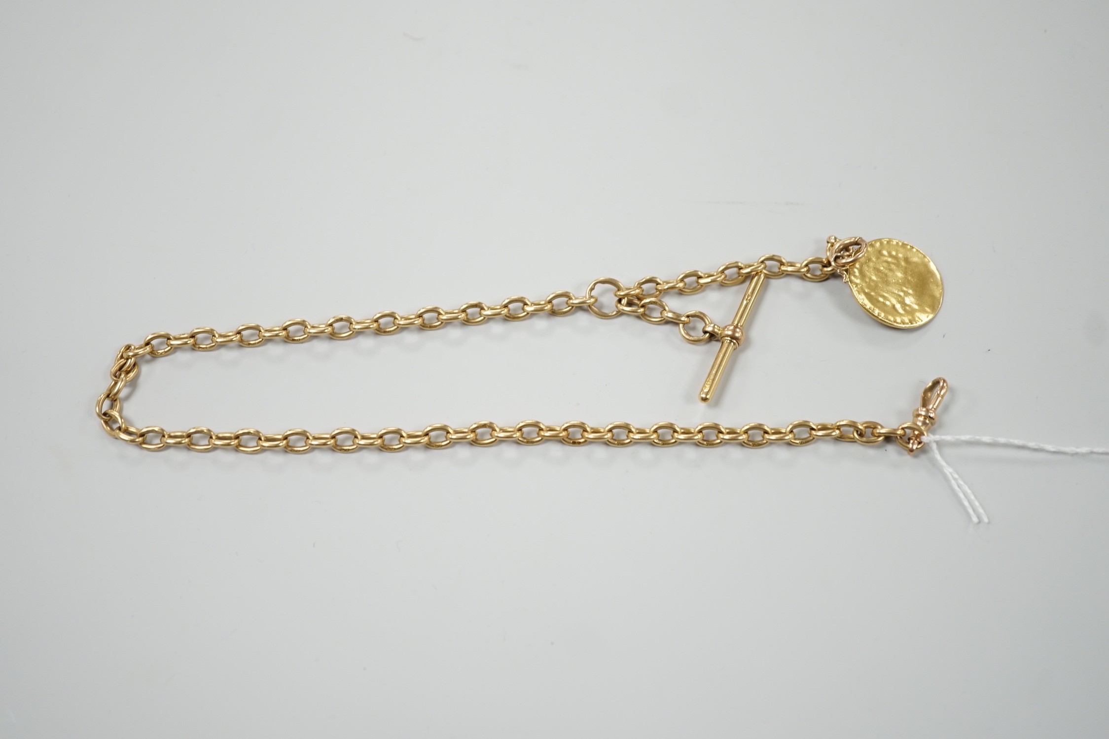 An early 20th century 18ct gold albert, 44cm, hung with a gold coin (worn), chain 53 grams, coin and bale, 9 grams.